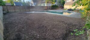Tatra Built team performing grading and excavating for landscape project in Macomb