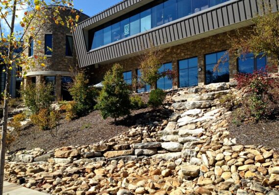 Artistic water feature designed with professional landscape design services