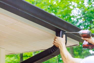 Illustration of a home gutter-to-drainage system with downspout drain installation preventing water damage
