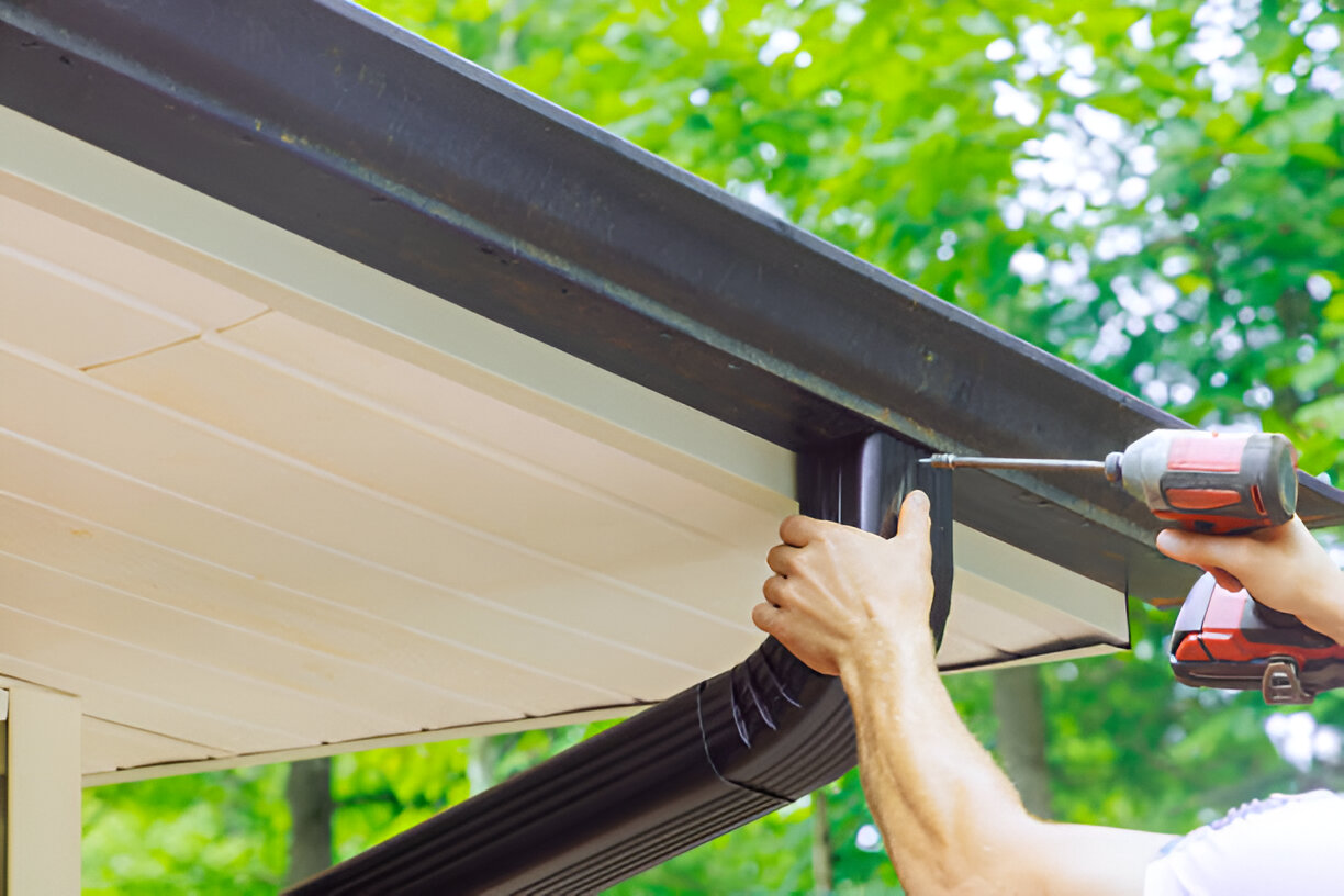 Illustration of a home gutter-to-drainage system with downspout drain installation preventing water damage