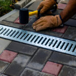 Professional French Drain Installation near foundation wall to prevent water damage