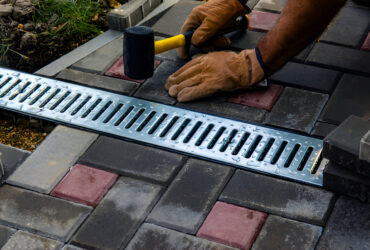 Professional French Drain Installation near foundation wall to prevent water damage