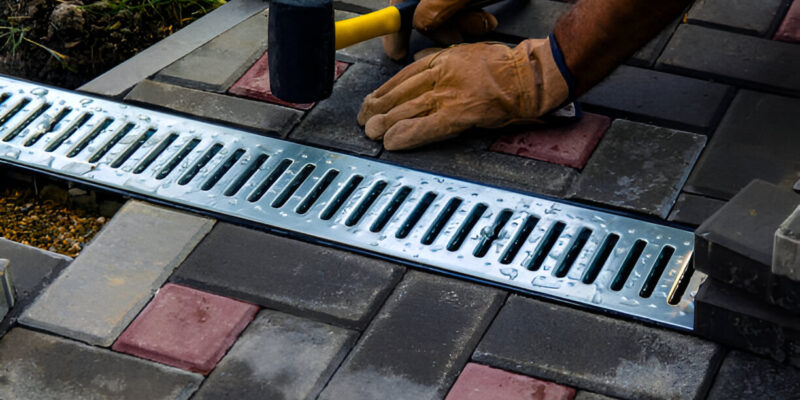 Professional French Drain Installation near foundation wall to prevent water damage